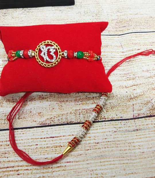 ELEGANT IK ONKAR & SILVER BEAD RAKHI - SET OF 2 1 ELEGANT IK ONKAR & SILVER BEAD RAKHI - SET OF 2