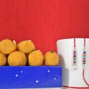 Send Gifts to Jalandhar 4 Ladoo with Bhaiya Bhabhi Rakhi